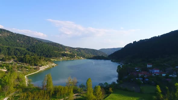 Distant mills, lake and village.