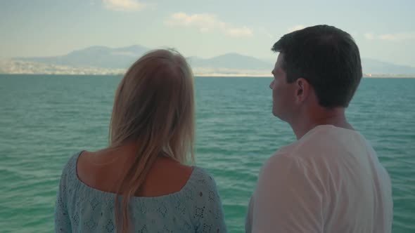 Woman and Man Speaking on Boat Against Sea Landscape Piraeus, Greece