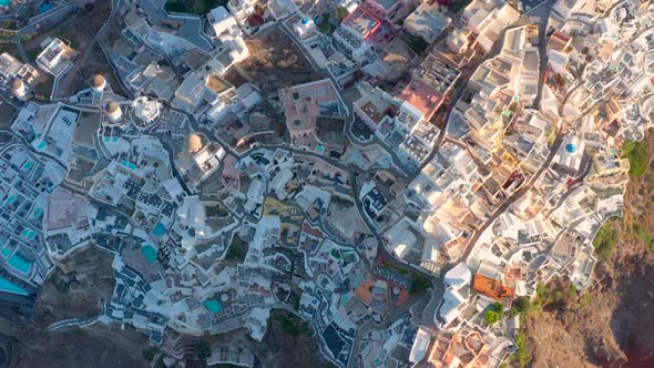 Aerial shot of famous Oia village in Santorini at sunrise in Greece