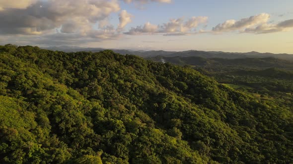 Fast backwards flight over the magnificent jungle of central America. Lush and vast mountainous land