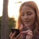 Red-haired Young Girl Using Cell Phone - VideoHive Item for Sale