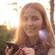 Portrait Of Smiling Happy Girl Using Phone And Looking At Camera - VideoHive Item for Sale