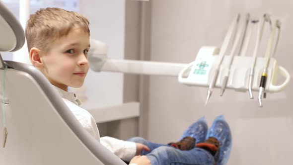 Dentistry. The dentist examines the baby teeth. Close-up