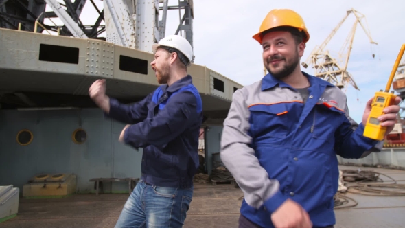 Funny Dancing Dock Worker And Engineer In Shipping Cargo Port