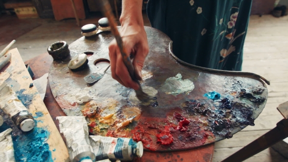 Woman Artist Mixing Oil Paint On a Palette