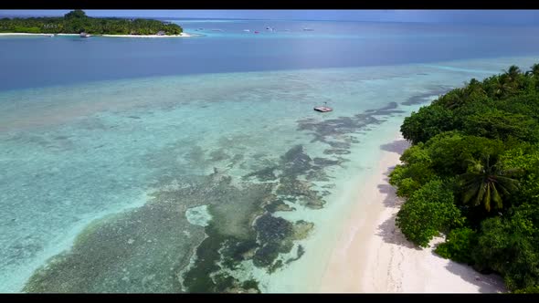 Aerial drone shot landscape of paradise lagoon beach time by turquoise ocean and white sandy backgro