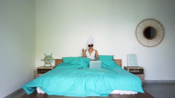 Woman Drink Coffee in Bed and Drone Fly Out Room