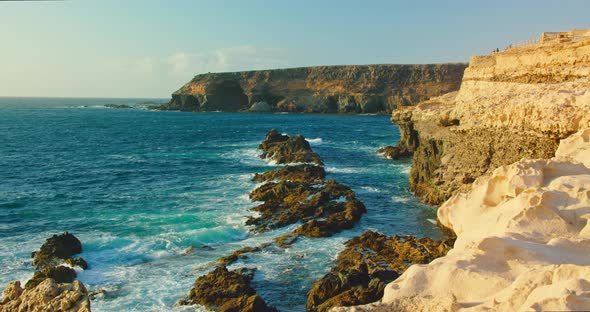 Sunset Soft Light on Famous Caves Rocky Coastline of Little City Ajuy Stone Beach in the South of