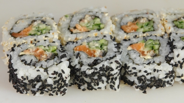 Sushi Chef Carefully Puts The Pieces Of Rolls. 