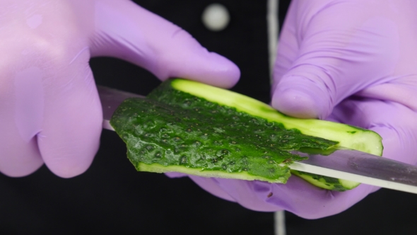 Chef Carves Crafts Cucumber. 