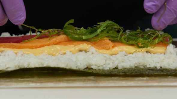 Chef Puts The Ingredients For Sushi. 