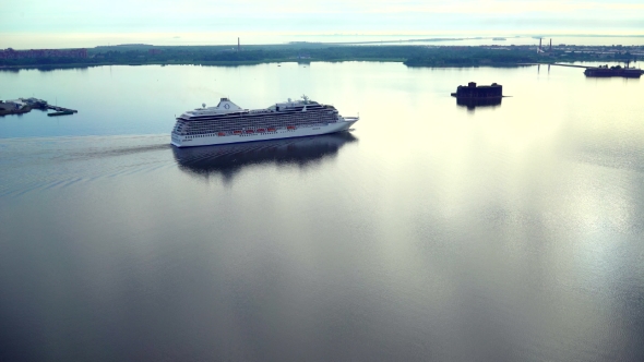 Aerial Shot Of Large Passenger Ferry Sails Sailing On Lake In Summer Sunrise