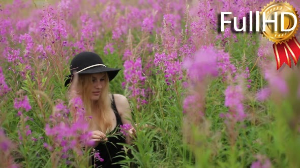 Girl in Dress Standing in Flowers Lupine