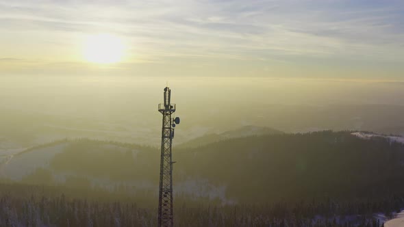 Flying Over Radio Communications Tower Mountain Snow Covered Winter Landscape