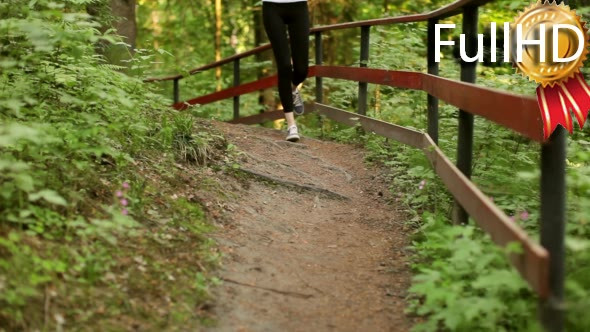 Beautiful Sports Girl Running in the Woods