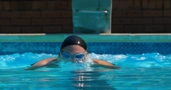 Male swimmer swimming inside pool 4k