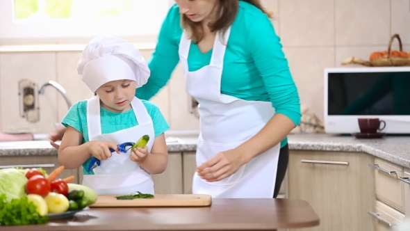 Mom Teaches Child To Clean Cucumber
