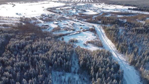 Aerial View From a Drone of a Small Village Winter Landscape Frosty Sunny Day Everything is Covered