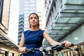 Young woman commuting on bicycle - PhotoDune Item for Sale