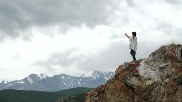 Woman Hiker Taking Photo With Smart Phone At Mountain Peak Cliff