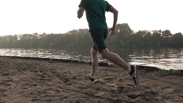 Super  Steadicam Video Of Athletic Man Running On Sandy Riverside, 240 Fps