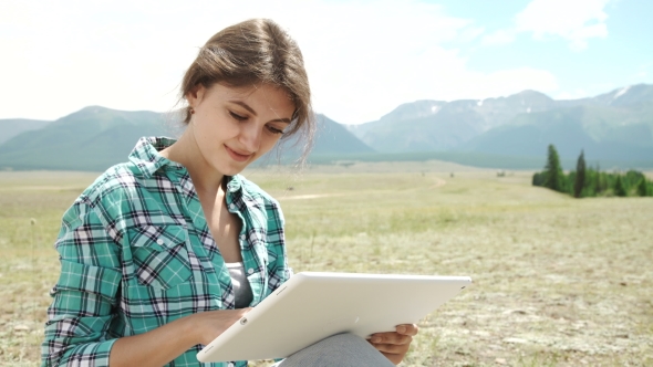 Beautiful Brown Girl, In a Wasteland, Using a Tablet Pc