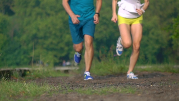 Athletic Girl And Man Running Together