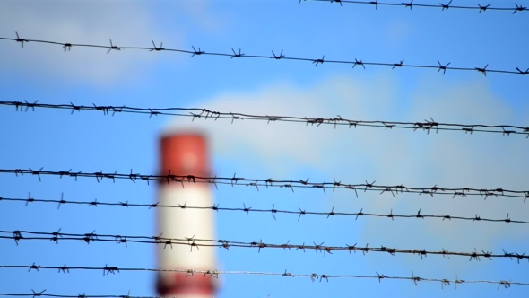 Barbed Wire And Pipe With Smoke