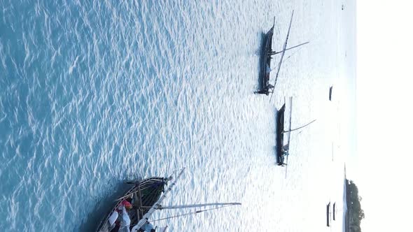 Vertical Video Boats in the Ocean Near the Coast of Zanzibar Tanzania Aerial View