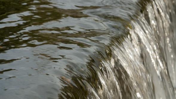 Flowing River Water .