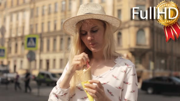 Beautiful Woman Eating Ice Cream on a Summer Day