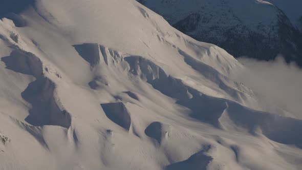 Aerial Panoramic View of Canadian Mountain Covered in Snow