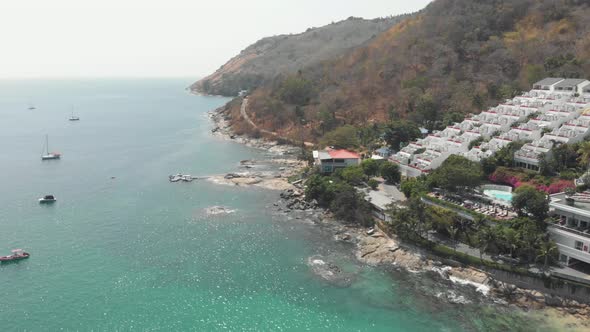 View over Nai harn Reef and beach luxury resort in the tropical landscape of Phuket, Thailand