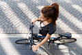Young woman commuting on bicycle - PhotoDune Item for Sale