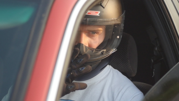 Rider Wearing a Helmet Behind The Wheel
