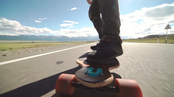 Guy On His Longboard Skate.  Of Longboard And Foot. Side View. Tracking Shot