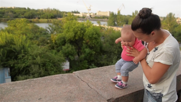 Little Girl Learning To Walk With His Mother, First Steps, Park, Sunny Day