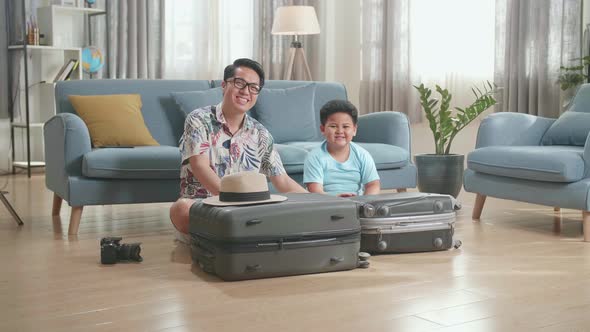 Happy Asian Father And Son Being Ready For An Adventure, Having Bags Packed For A Road Trip