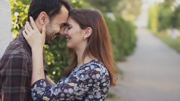 Man And Woman Hugging And Smile In City