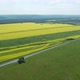 Aerial Flying Over Asphalted Intercity Speed Highway Passing Through Green and Yellow Rural Fields - VideoHive Item for Sale