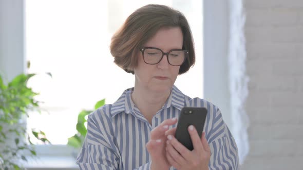 Senior Woman Using Smartphone Internet