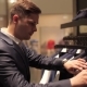 Man Choosing Business Jacket From The Raw In The Shop. - VideoHive Item for Sale