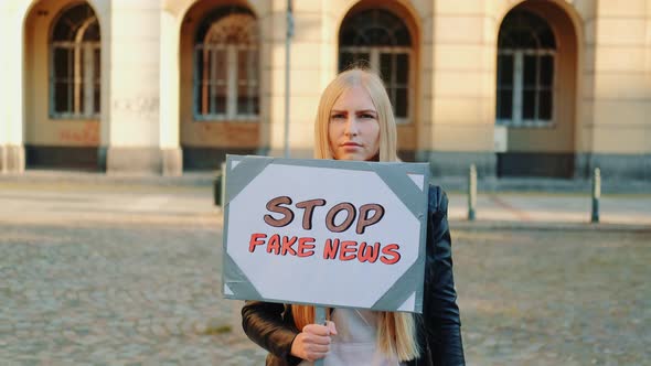 Young Woman Protesting Against Fake News