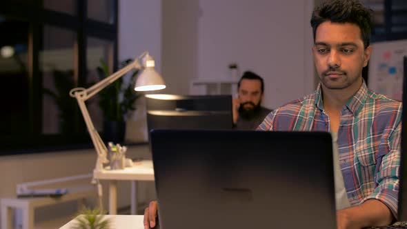 Indian Man with Laptop Working at Night Office 44