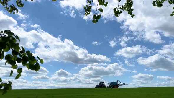 Tractor Sprays Fertilizer on the Field
