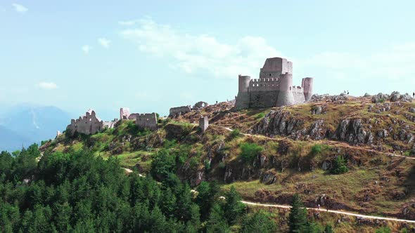 Aerial View of Ancient Castle on Mountain Hill Pine Forest on Mountain Slope