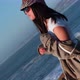 Rotating portrait of a beautiful young Latin woman in a sunset, pichilemu, chile. - VideoHive Item for Sale