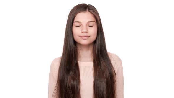 Horizontal Portrait of Charming Happy Female Model with Very Long Dark Hair Looking at Camera