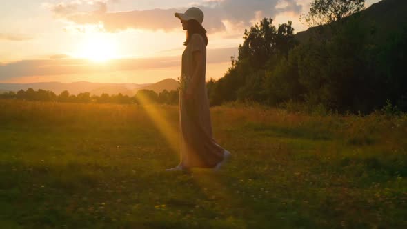 Profile Woman Strolls in Countryside Sundown
