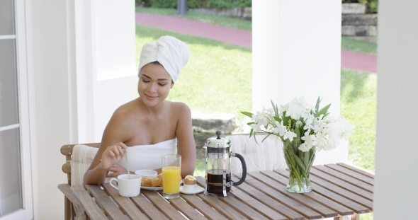 Grinning Woman At Breakfast Table Outdoors